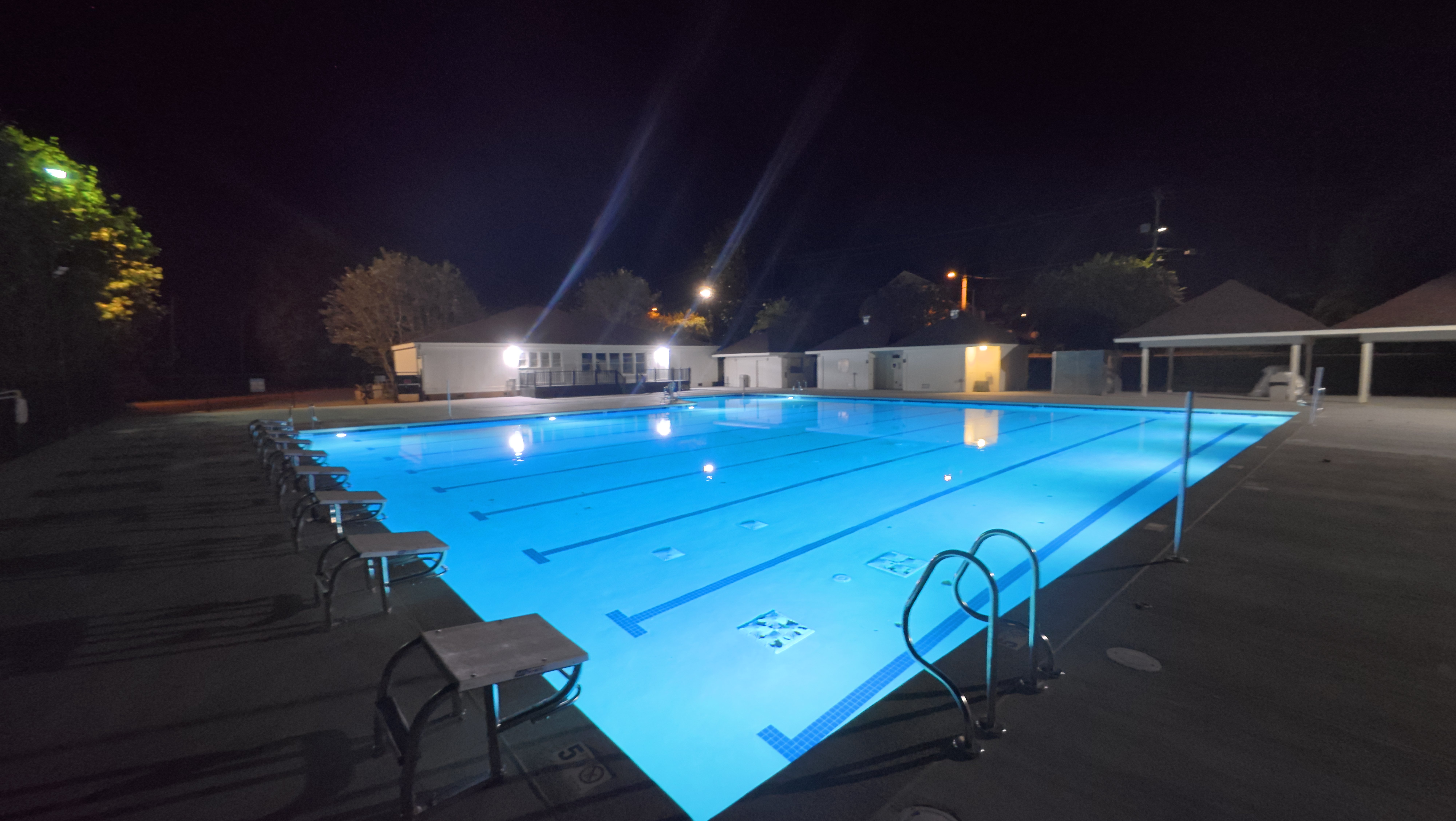 MSA Sardis pool at night, underwater lights illuminating the lanes